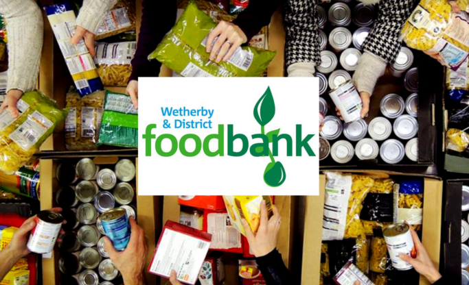 Volunteer Vacancies at Wetherby and District Foodbank. Image of logo over photo of hands sorting food parcels.